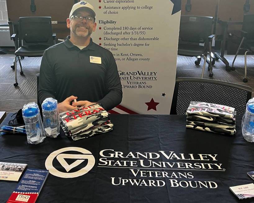 Program Specialist George Rader at an event table